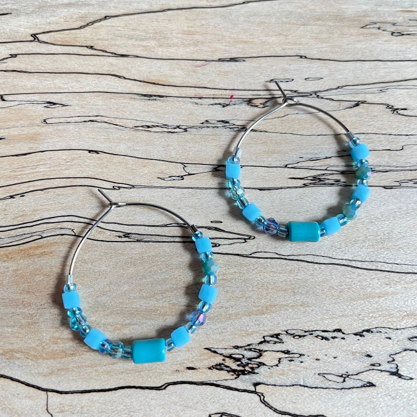 Beaded medium size stainless steel silver hoop earrings