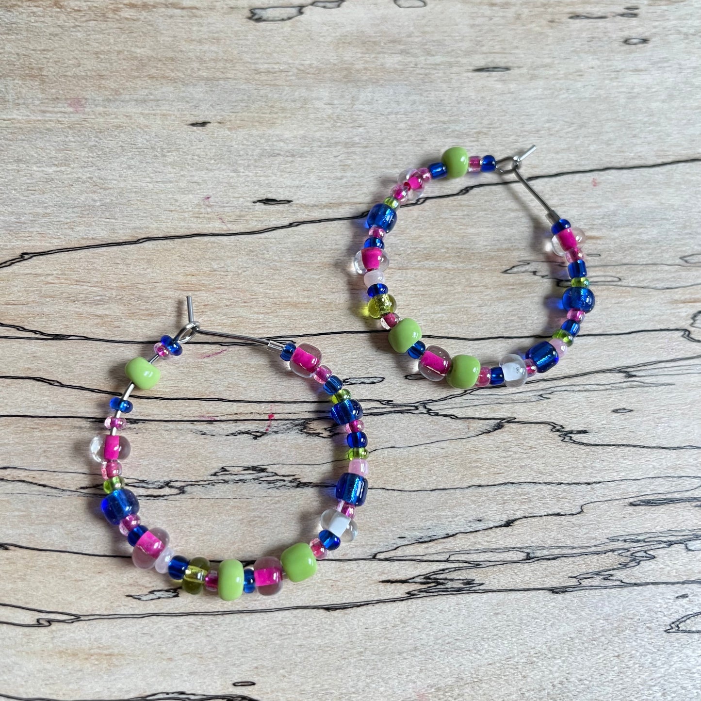 Beaded medium size stainless steel silver hoop earrings