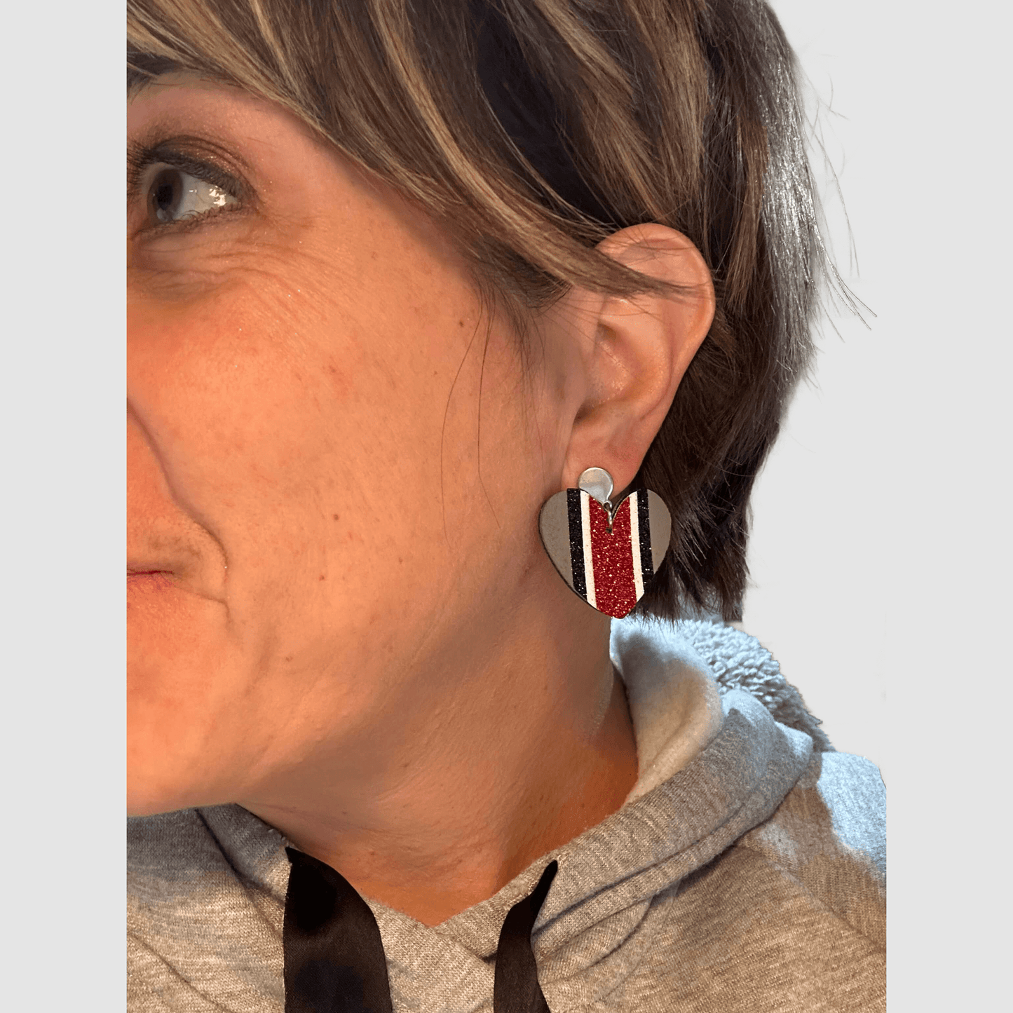 Heart shaped helmet stripe faux leather dangle earrings