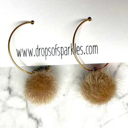 20mm round 24k shiny gold plated  "hoops" with fun little tan fuzzy pom poms attached