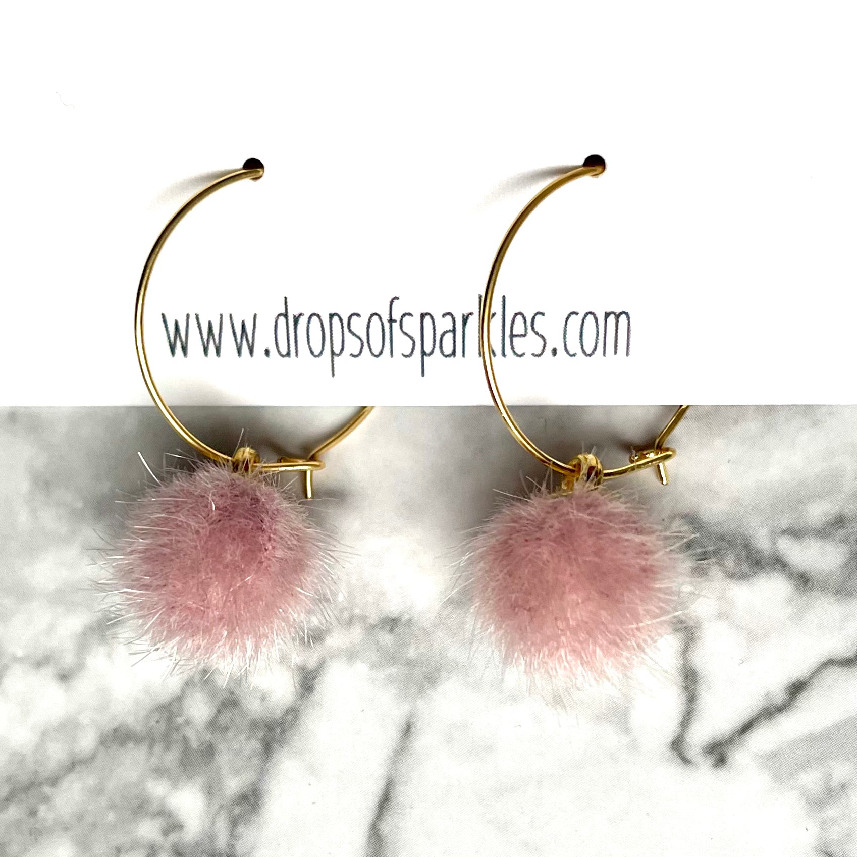 20mm round 24k shiny gold plated  "hoops" with fun little pastel petal pink fuzzy pom poms attached