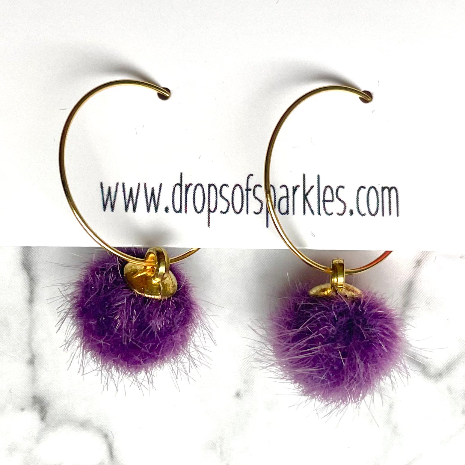 20mm round 24k shiny gold plated  "hoops" with fun little purple fuzzy pom poms attached